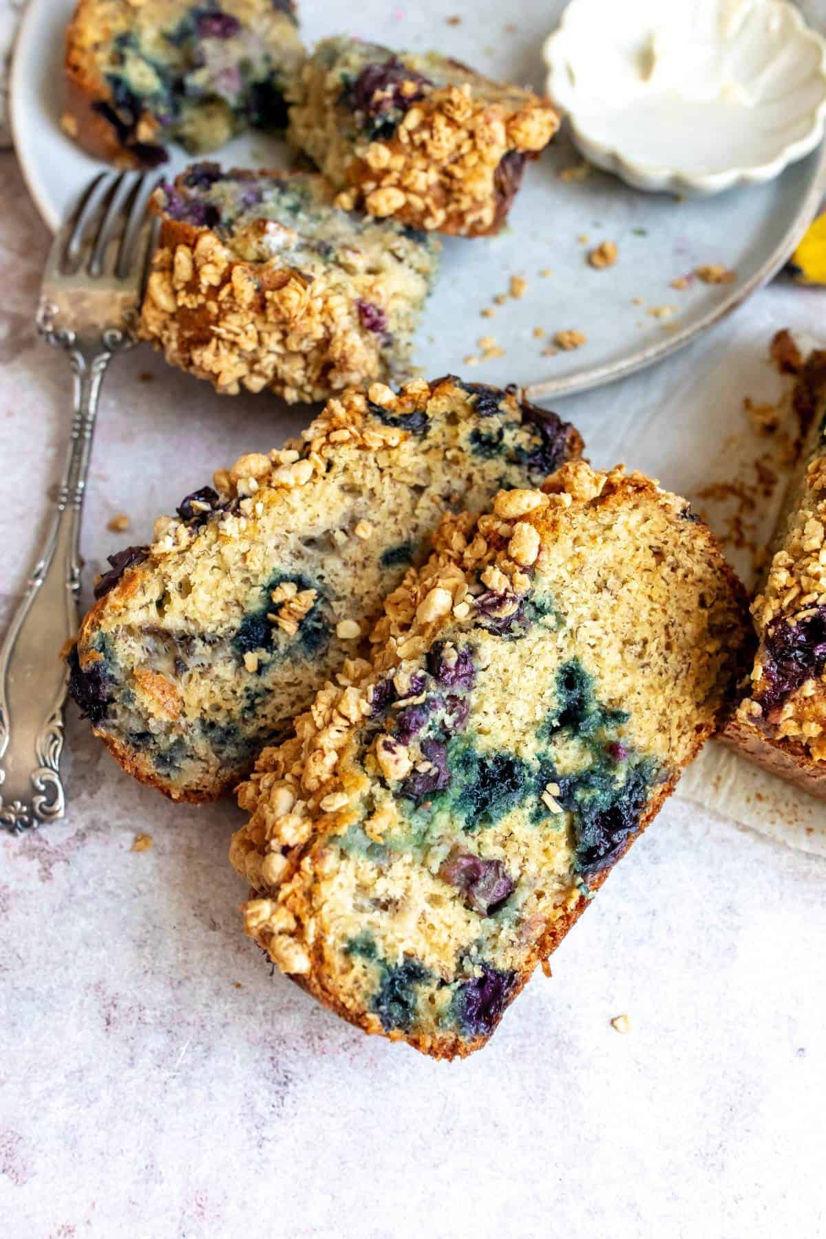 Banana Blueberry Nut Bread on a counter with a fork.