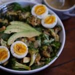 Loaded arugula salad with maple garlic dressing