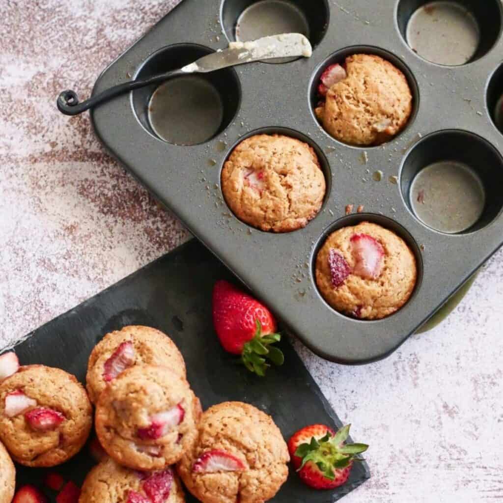 Strawberry Muffins in a muffin tin. 