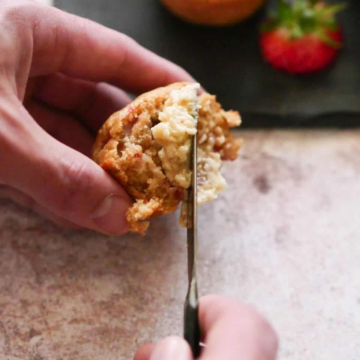 Strawberry Muffins with butter on top.