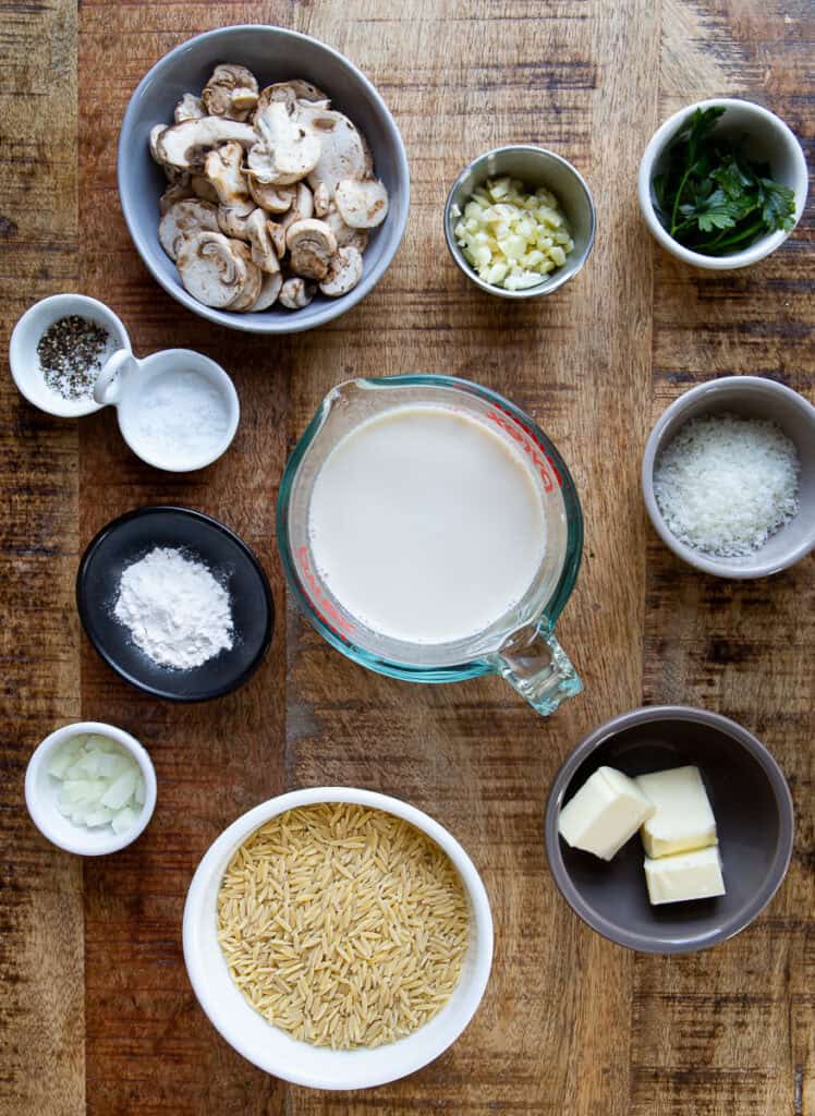 All the ingredients for orzo. Mushrooms, garlic, parsley, cheese, milk, starch, salt & pepper.