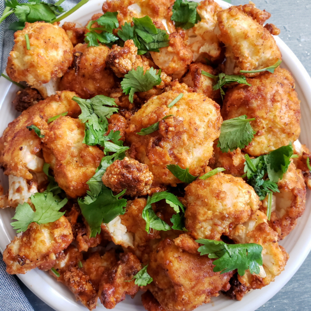 The finished BBQ Cauliflower Wings ready to eat with cilantro on top