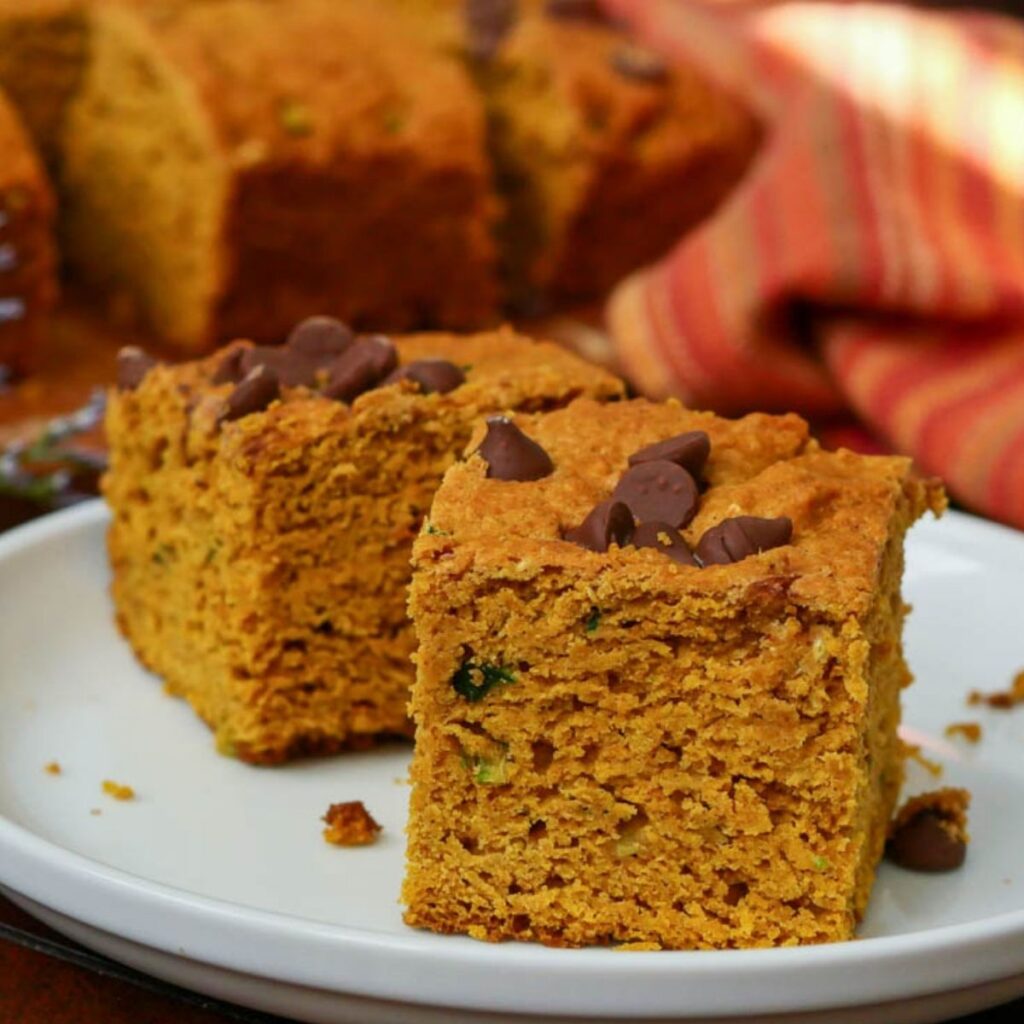 Pumpkin Zucchini bread baked and placed on a white plate. 