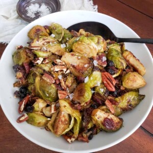 Roasted Brussel Sprouts With Cashew Dressing in a white bowl.