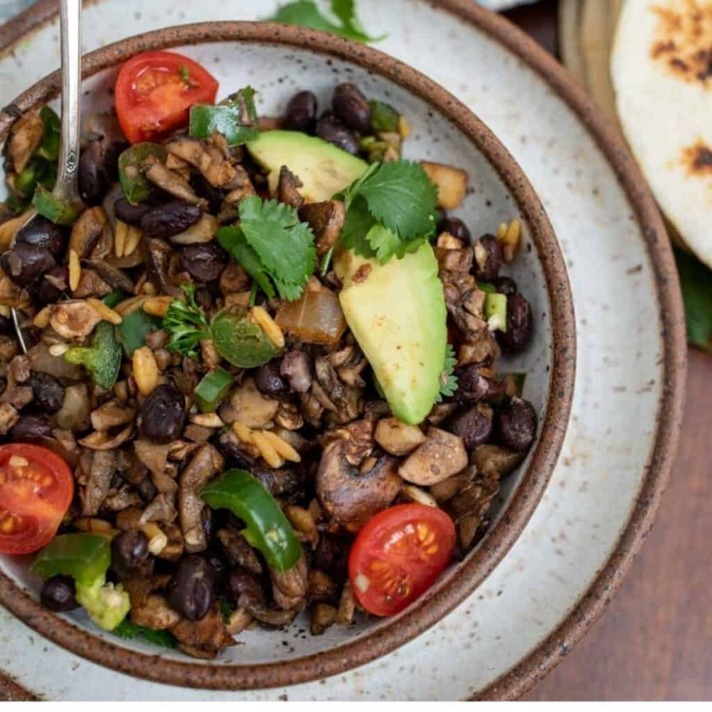 A bowl with the mushroom taco mix in it.