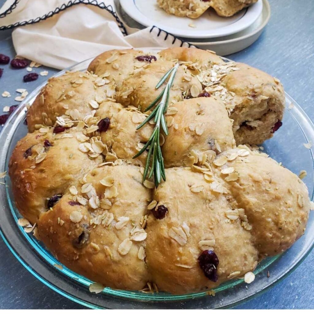 Cranberry Herbed Oat Rolls in a baking dish. 