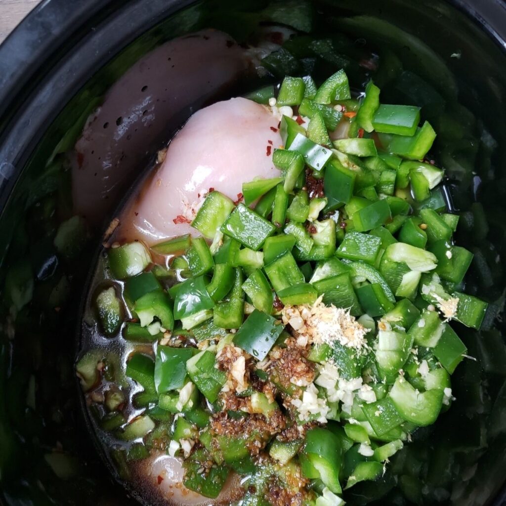 All ingredients piled into a crock pot. 