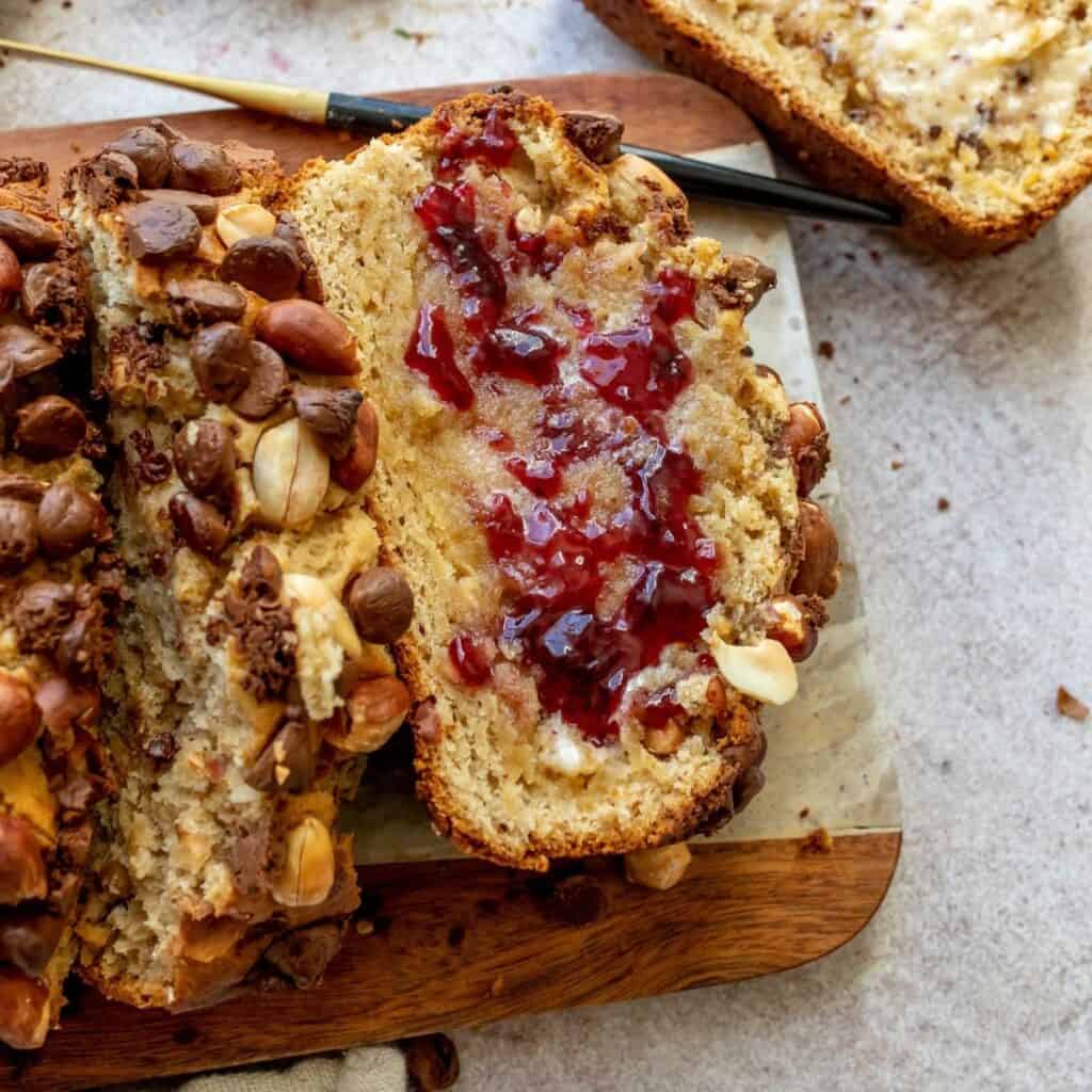 peanut butter bread with jelly and butter on top.