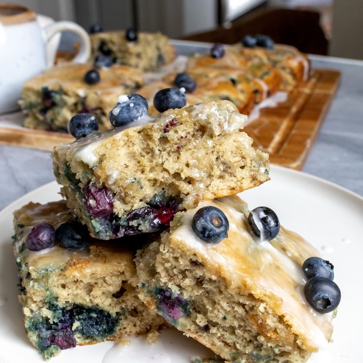Blueberry Breakfast Cake with tahini. on a white plate. 