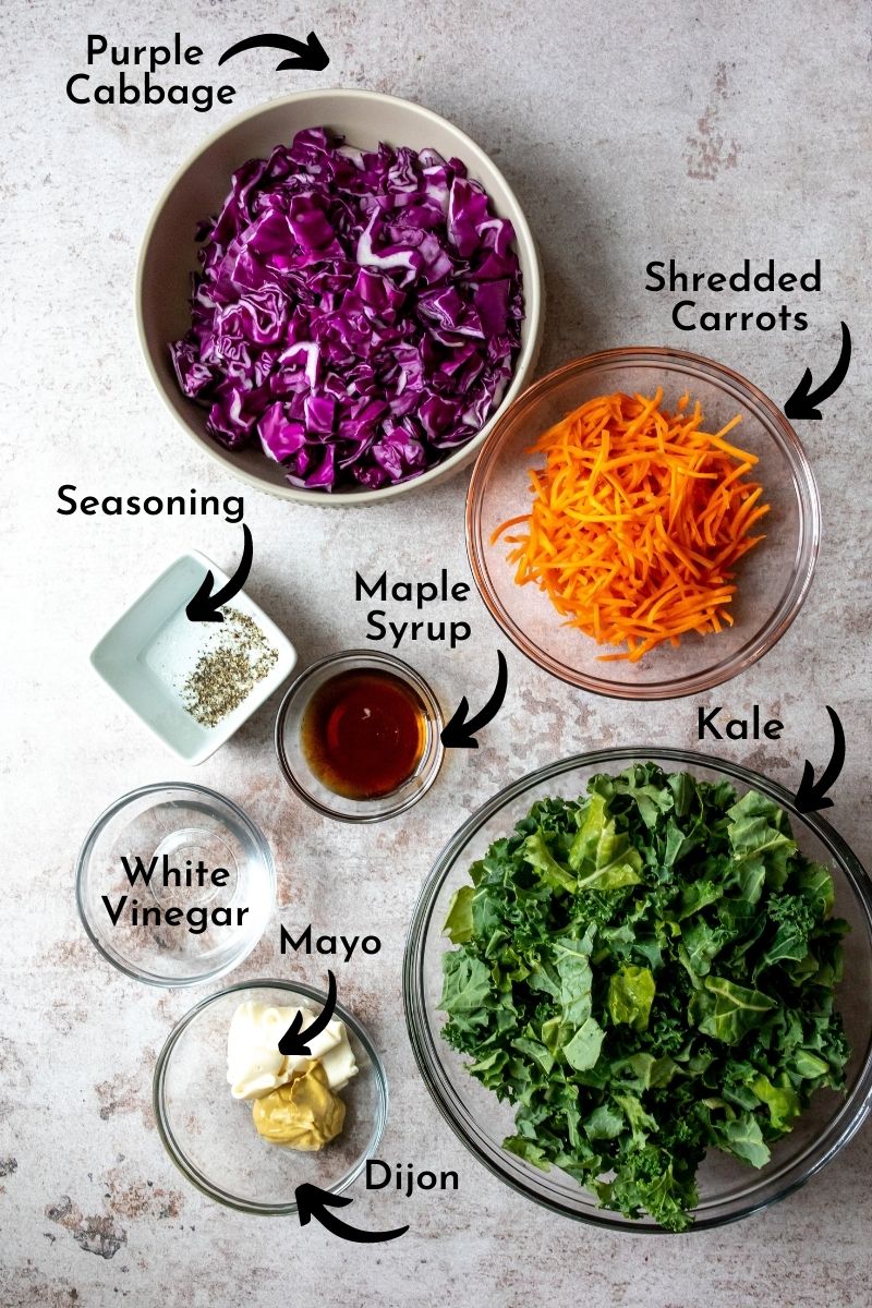 Kale slaw ingredients in bowls. 