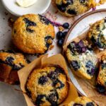Banana Blueberry Muffins on a plate with butter.