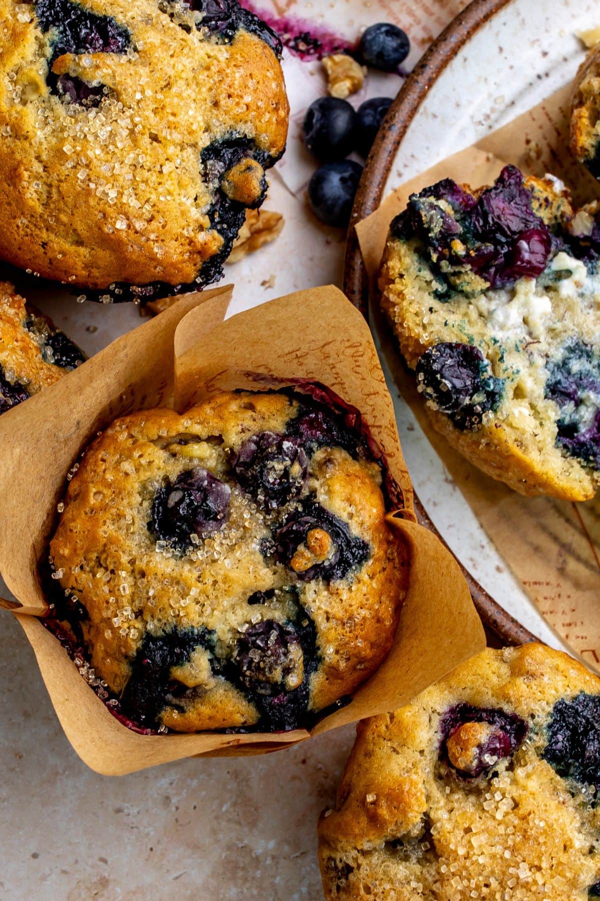Banana blueberry muffins up close on a plate.