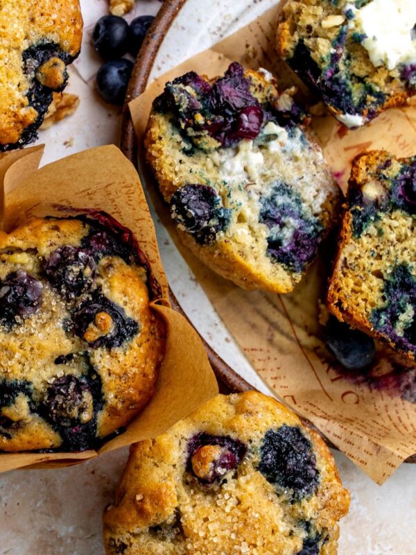 Banana blueberry muffins up close on a plate.