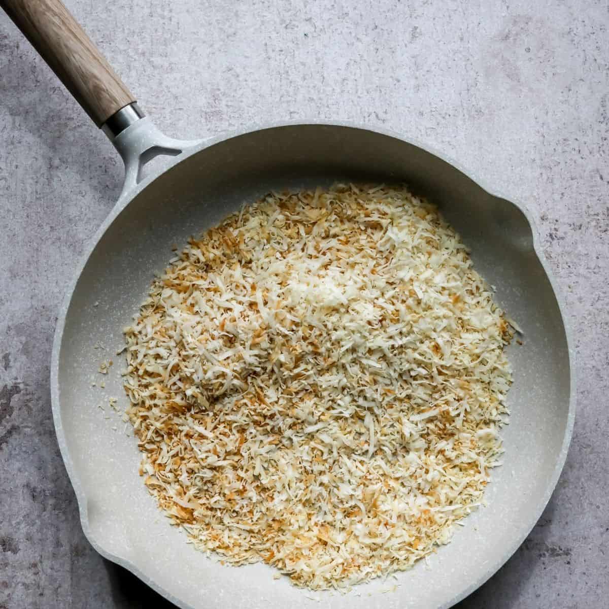 Toasted coconut in a pan. 