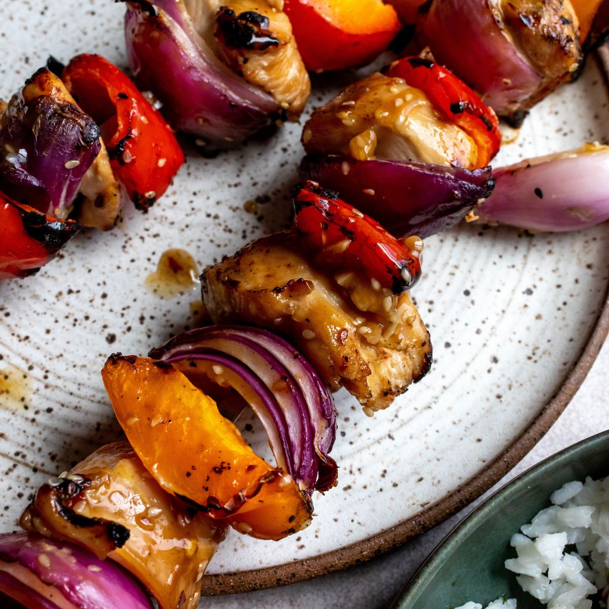 Healthy Teriyaki Chicken Kabobs Up close on a plate. 