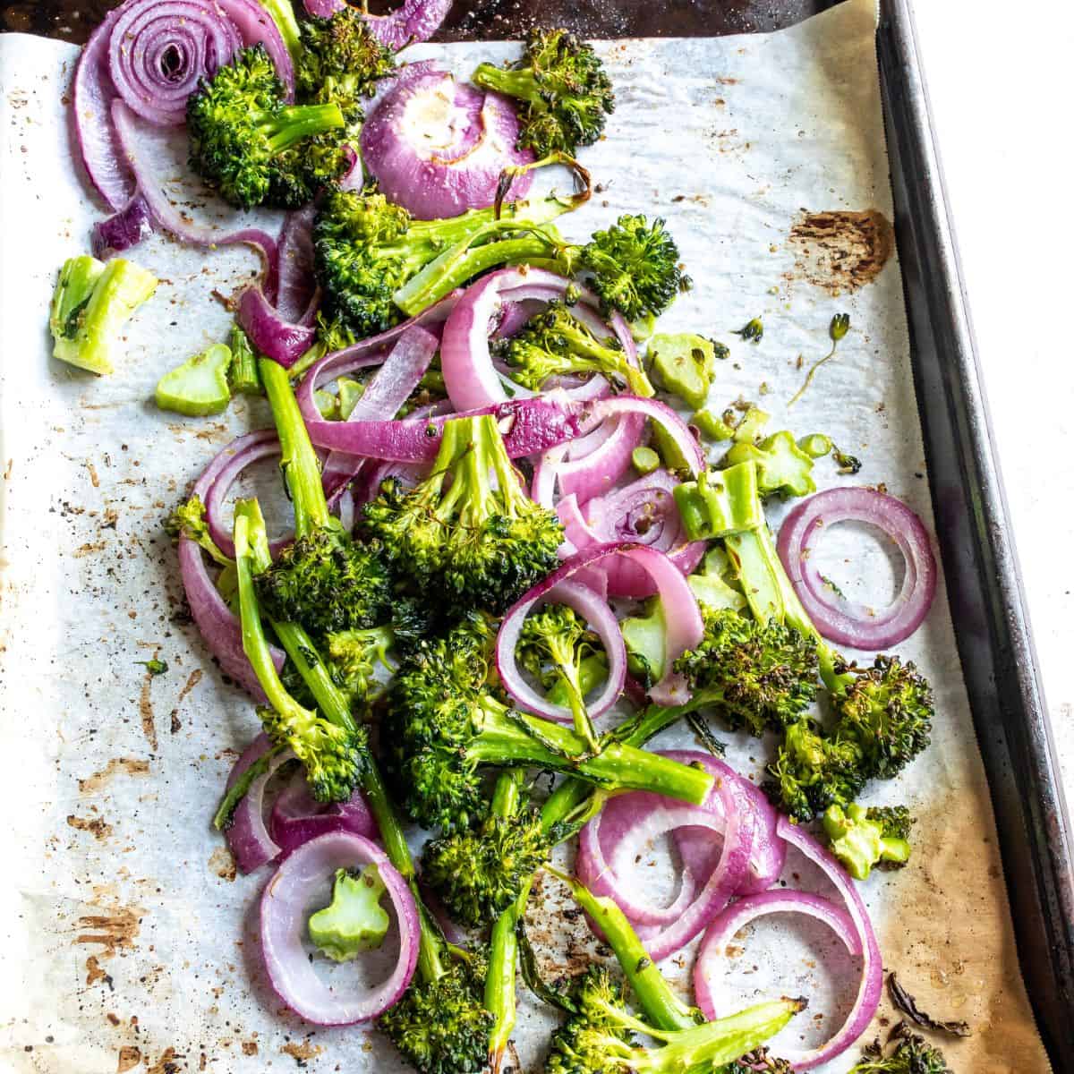 Quinoa Veggie Bowl roasted veggies on parchment paper. 