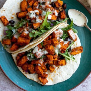 Sweet Potato Black Bean Tacos on a green plate.