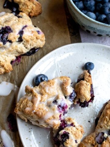 Blueberry Cardamom Scones on a white plate.