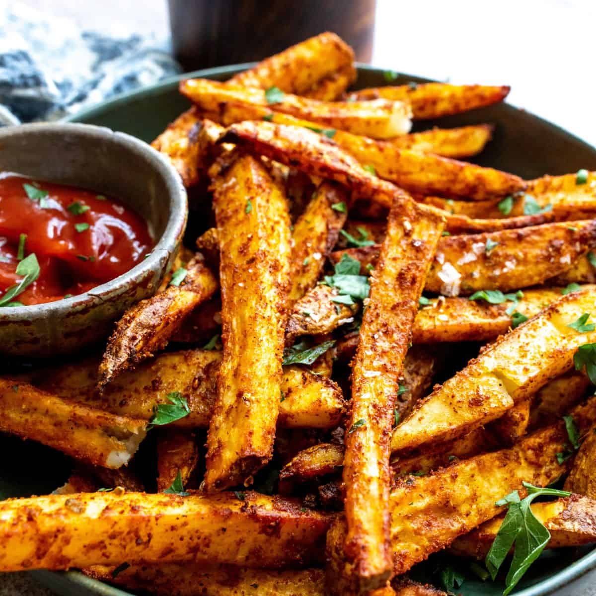 Crispy Homemade Fries up close and served with ketchup. 