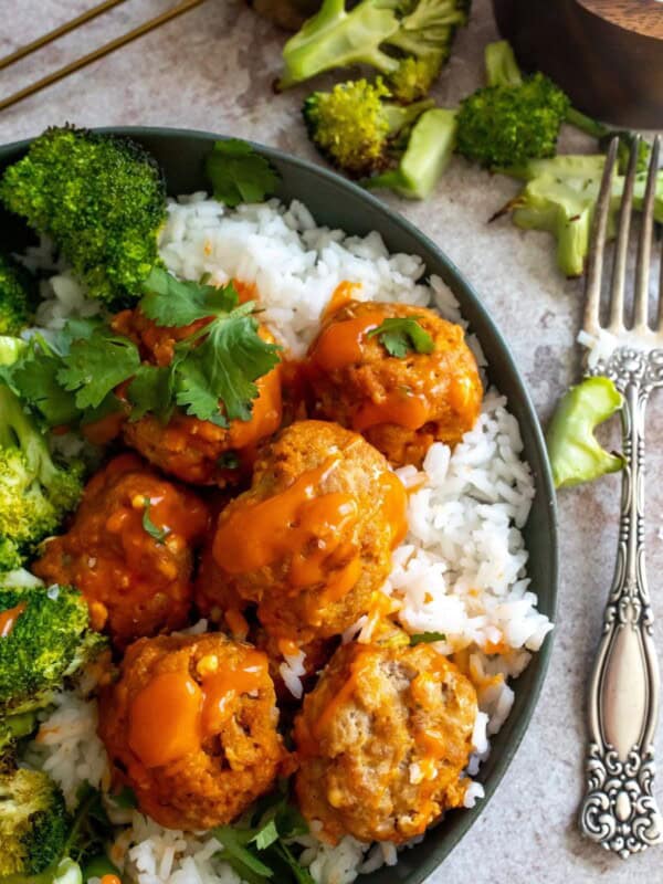 Buffalo Chicken Meatballs in a bowl with rice and broccoli.
