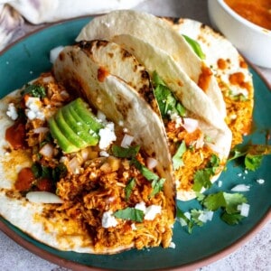 Chipotle Chicken Tacos on a green plate.