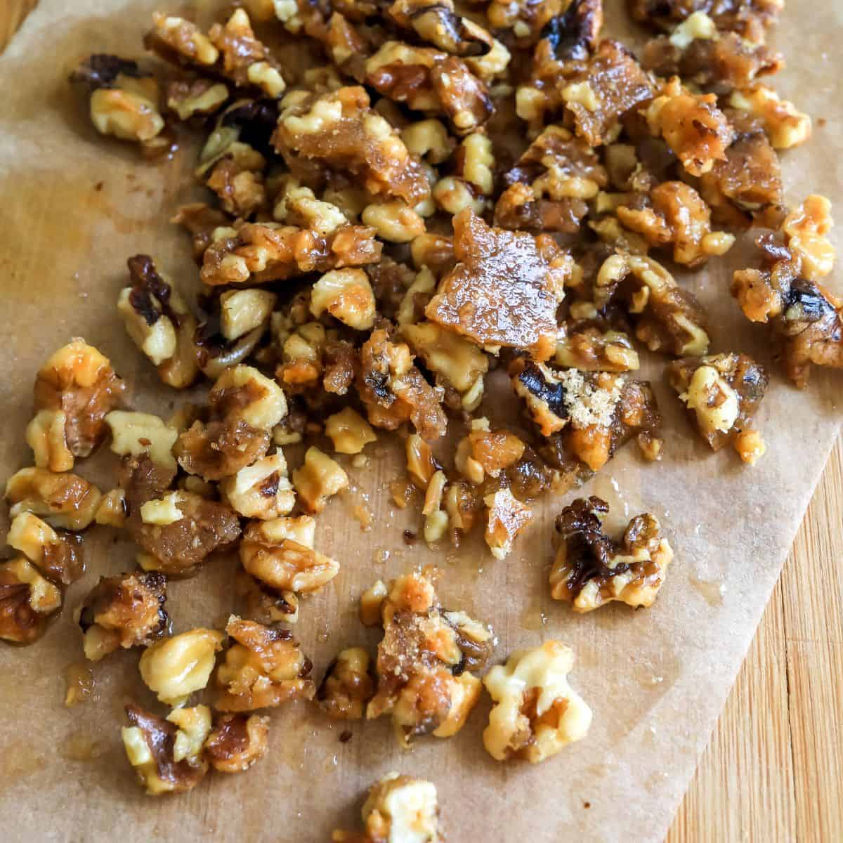 Candied walnuts on parchment paper. 