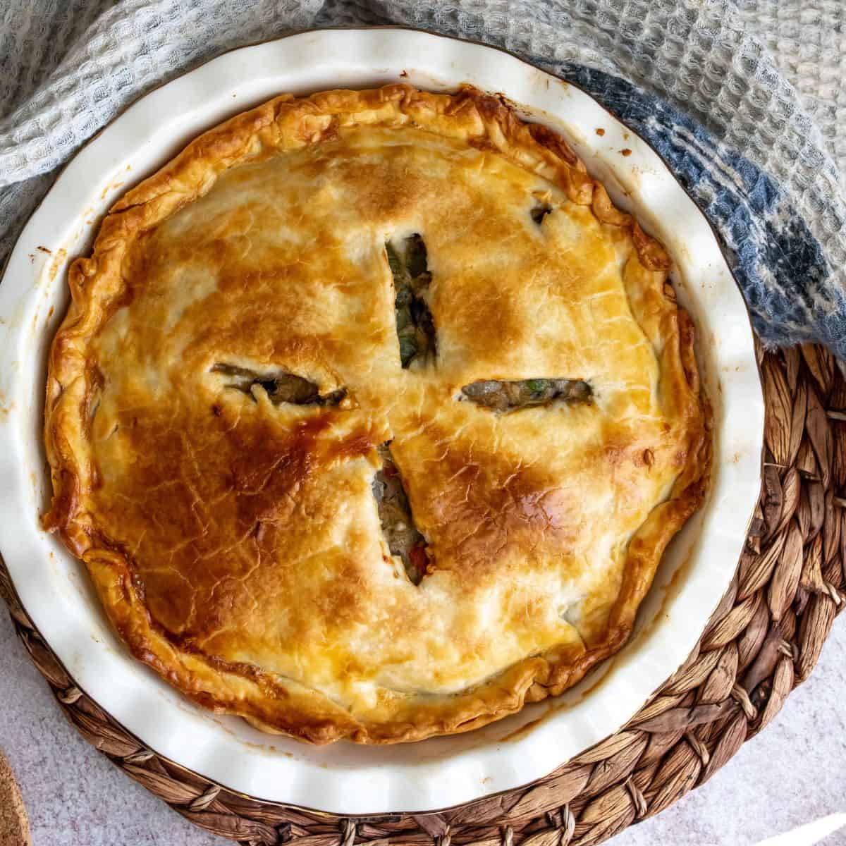 Healthy Chicken Pot Pie on a hot  pad in a pie dish.