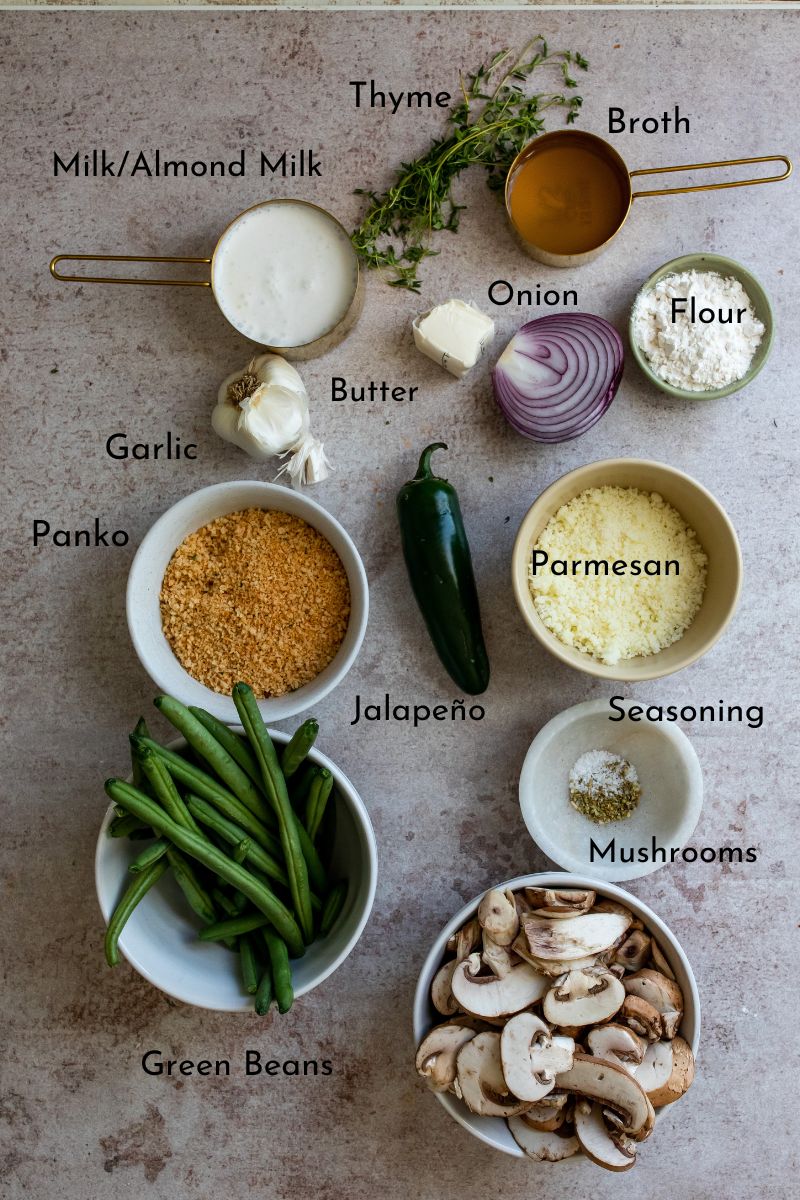 Ingredients needed for Healthy Green Bean Casserole on a counter with bowls. 