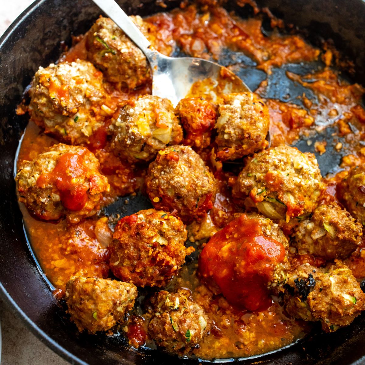 Ground Turkey Meatballs up close in a skillet.