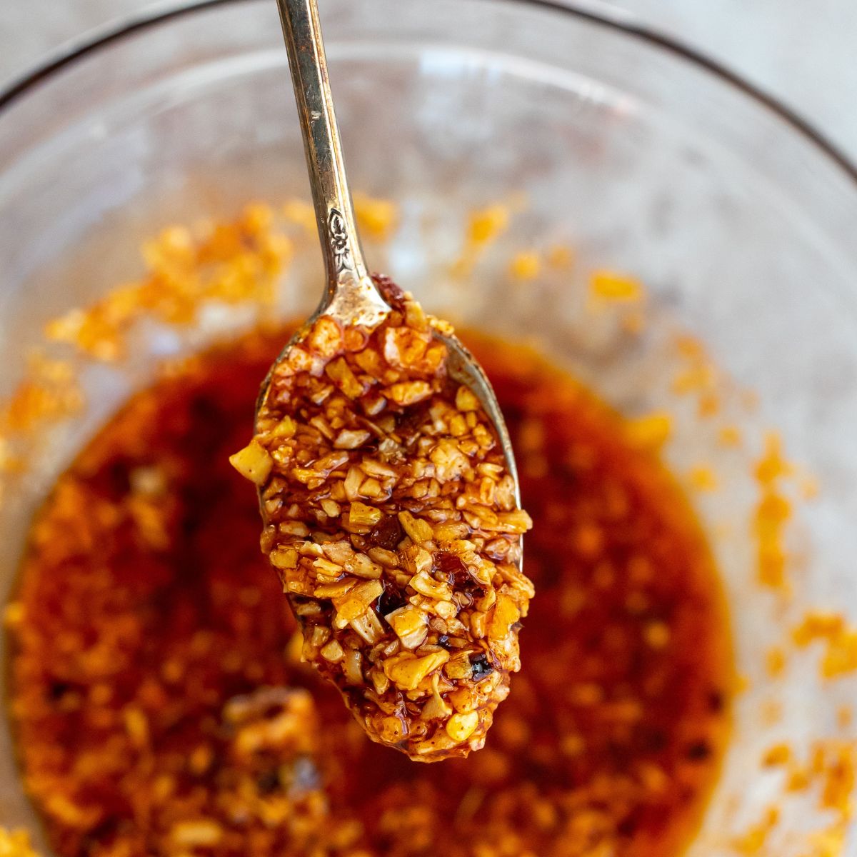 Chili onion crunch up close on a spoon.