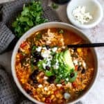 Soup in a grey bowl with a spoon