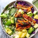 Blacked chicken in a bowl with cilantro lime dressing.