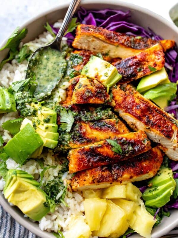 Blacked chicken in a bowl with cilantro lime dressing.