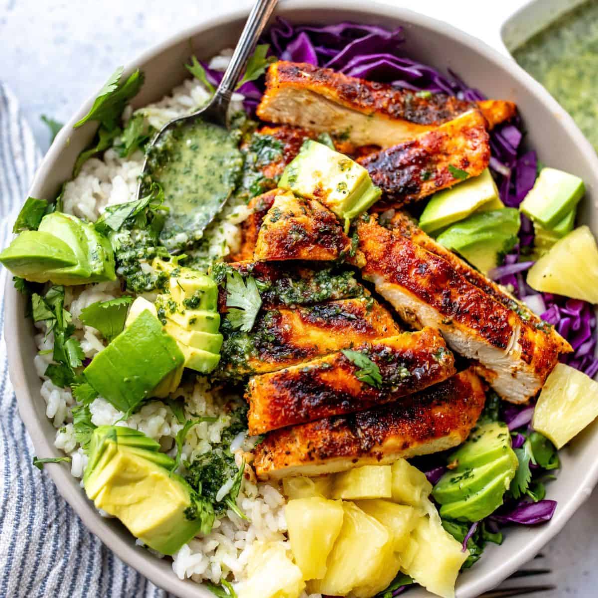 Blacked chicken in a bowl with cilantro lime dressing.