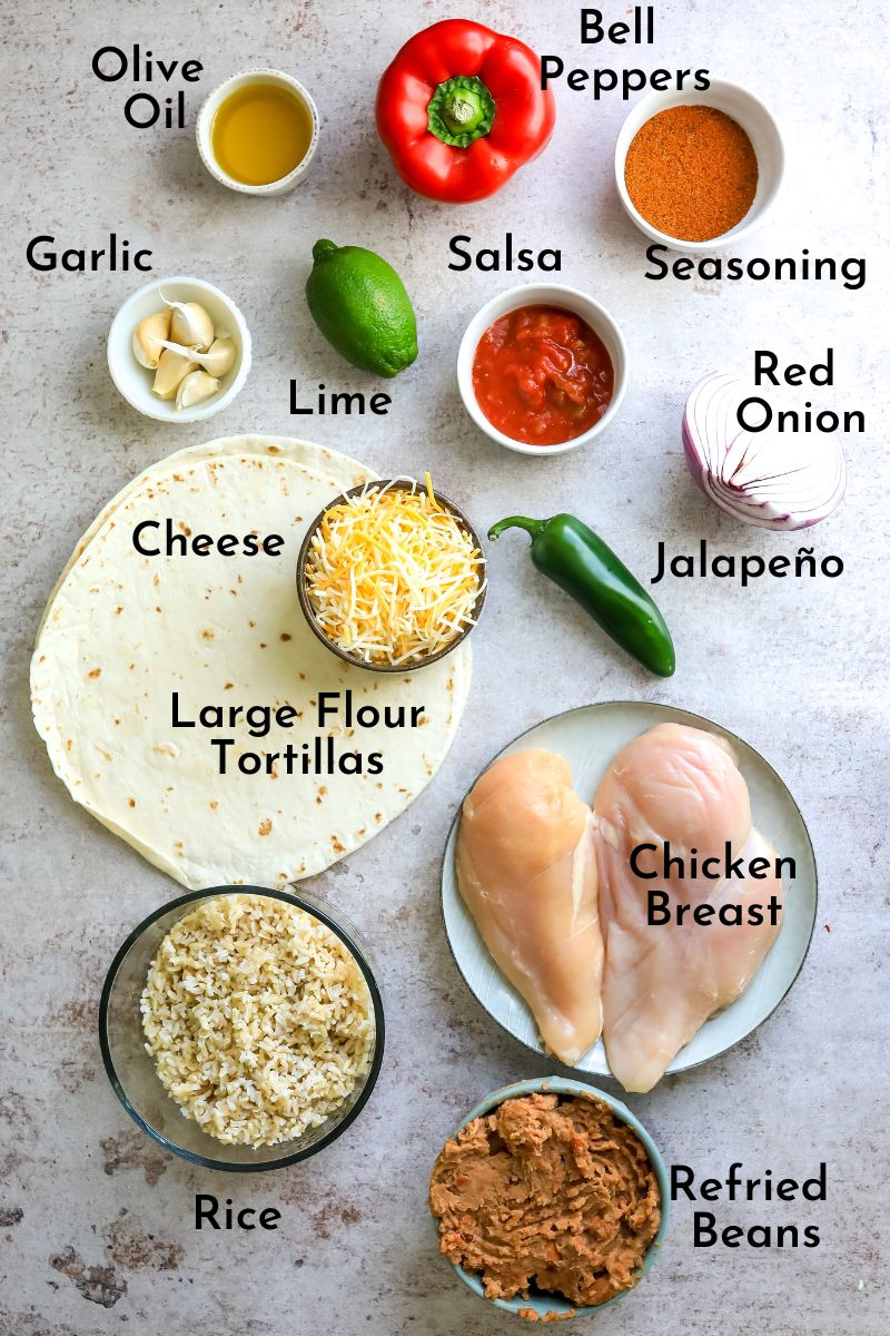 Ingredients to make this wrap on a counter in colored bowls and fresh ingredients. 