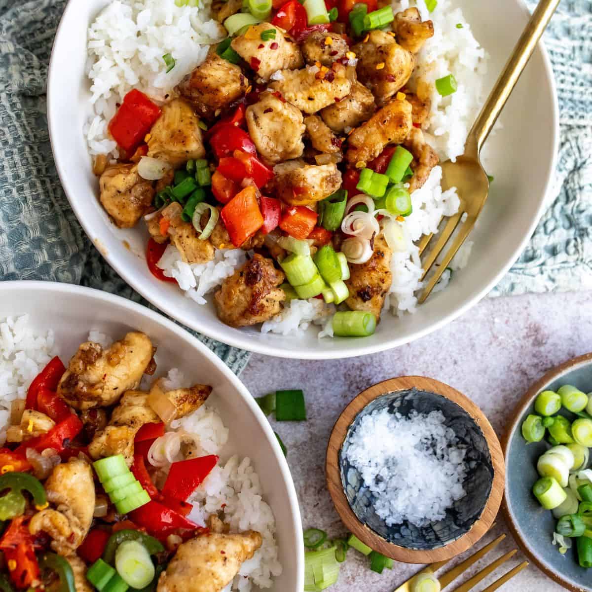 Crispy Chicken with salt and pepper seasonings served over rice with veggies.