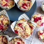 Muffins on a cooling wrack with a grey plate.