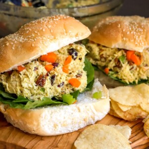 Chicken salad on toasted sesame buns with lettuce.