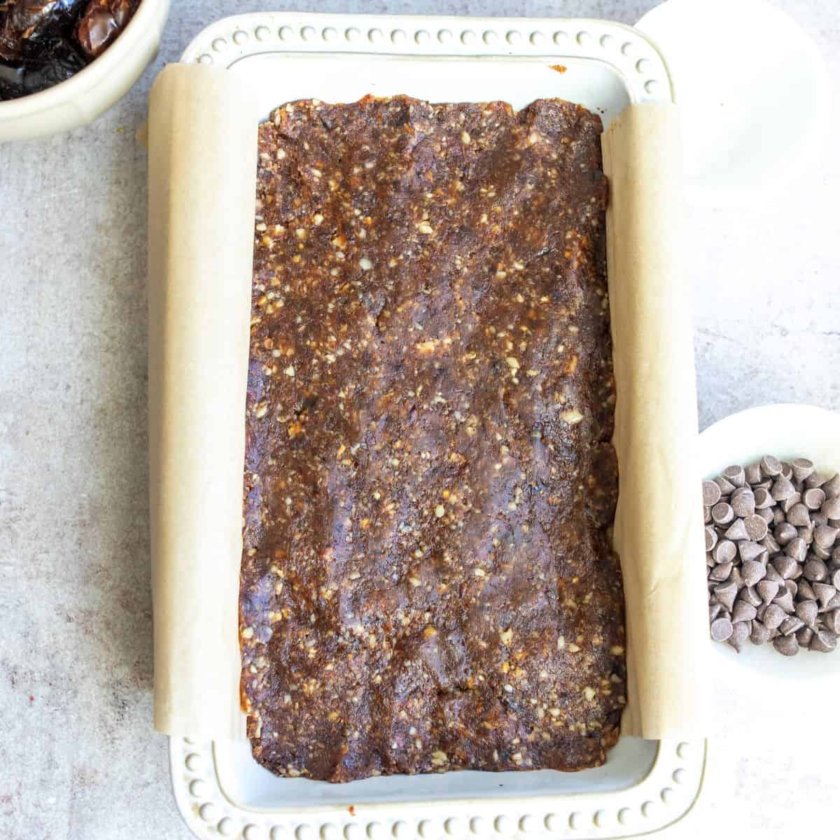 Dates pressed into a bread tin to make chewy blondies.