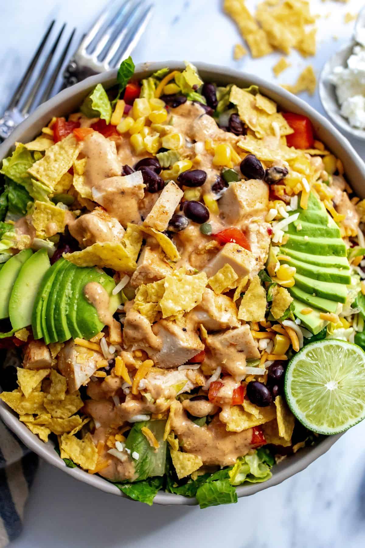 Spicy Southwest Salad up close with avocado slices on it.