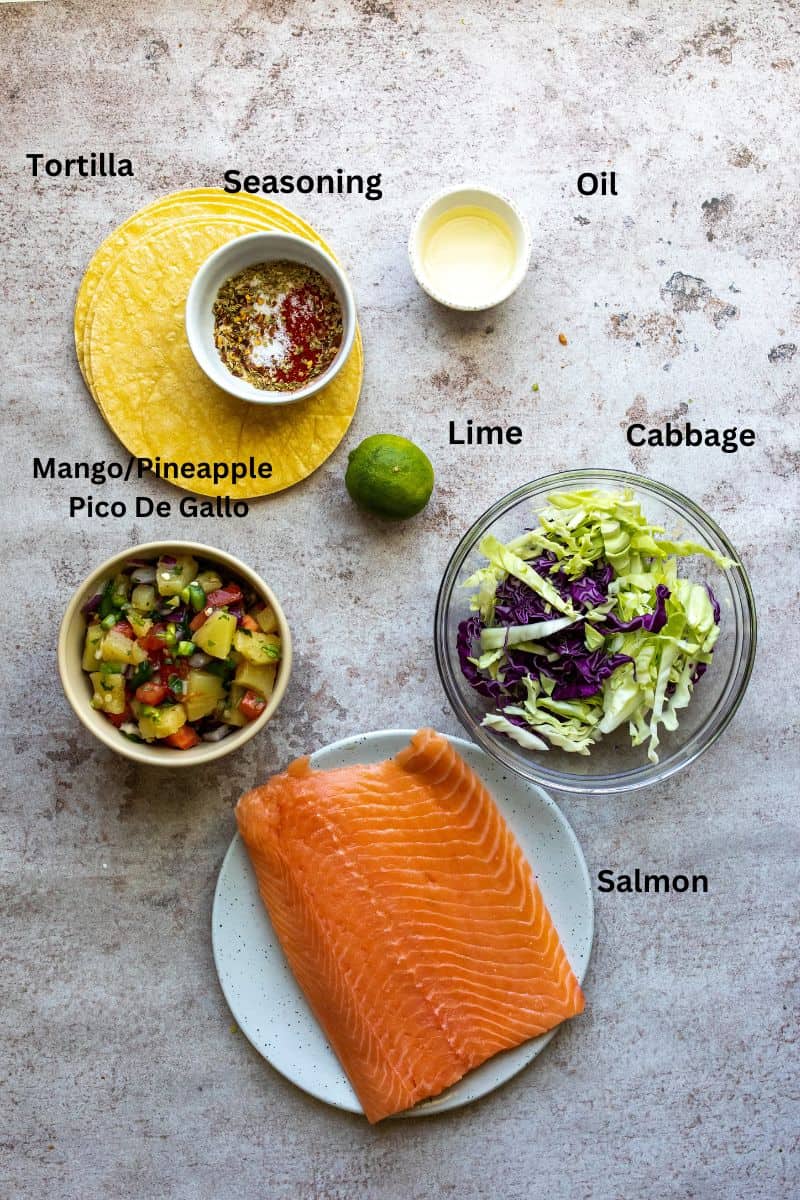 Ingredient on a grey counter in small little bowls and plates. 