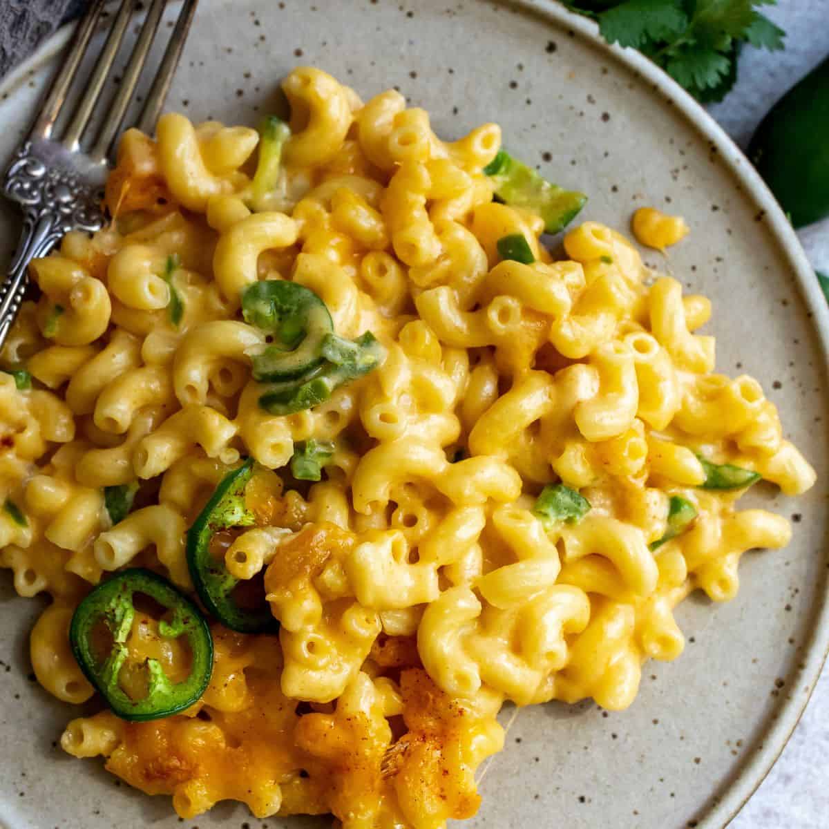 Cheese noodles on a plate with jalapeño spice. 