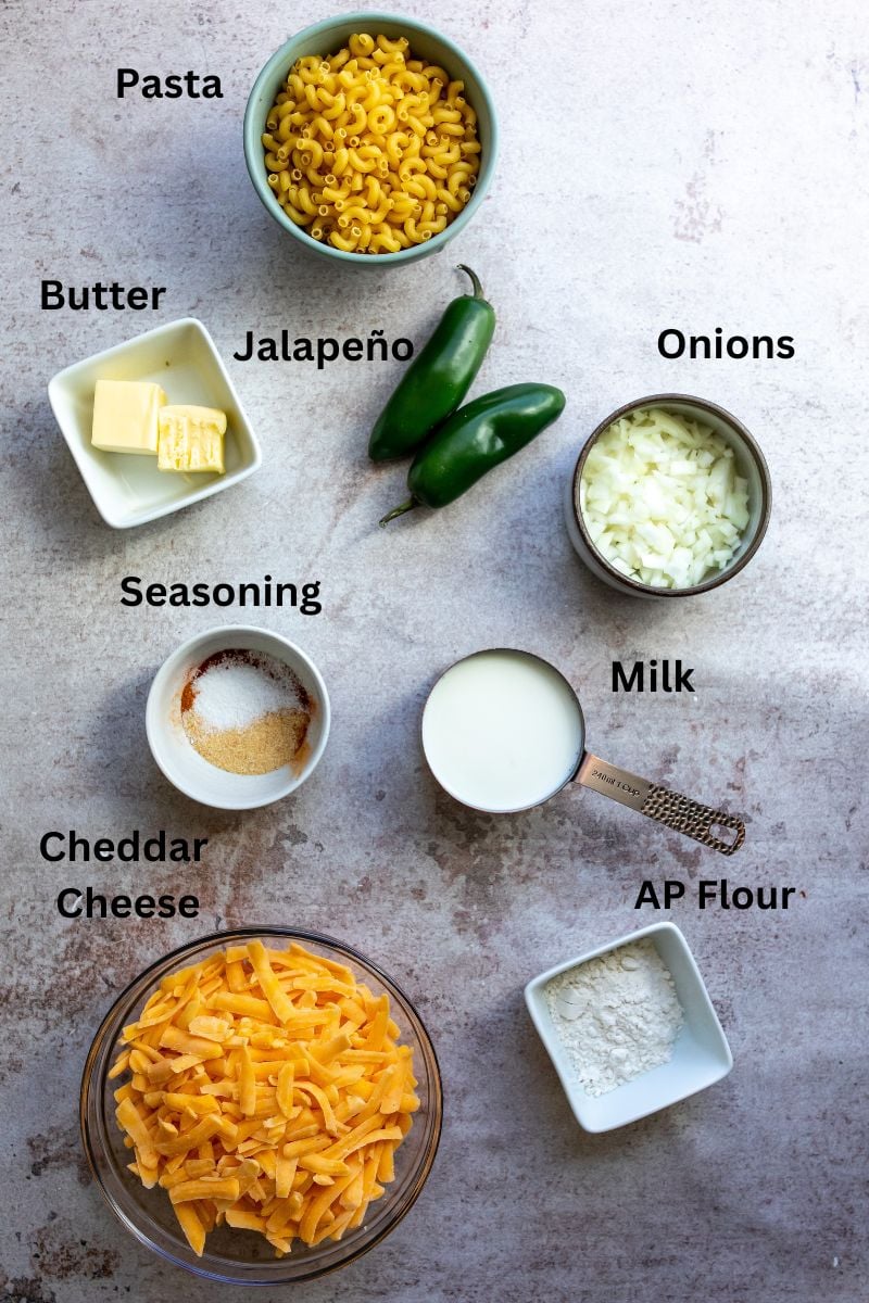 All ingredients needed to make the recipe on a gray counter in measuring cups. 