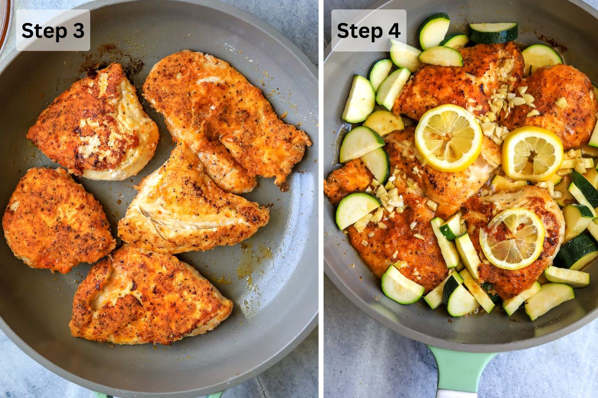 A grey skillet with chicken in it cooking and lemons, zucchini in the skillet. 