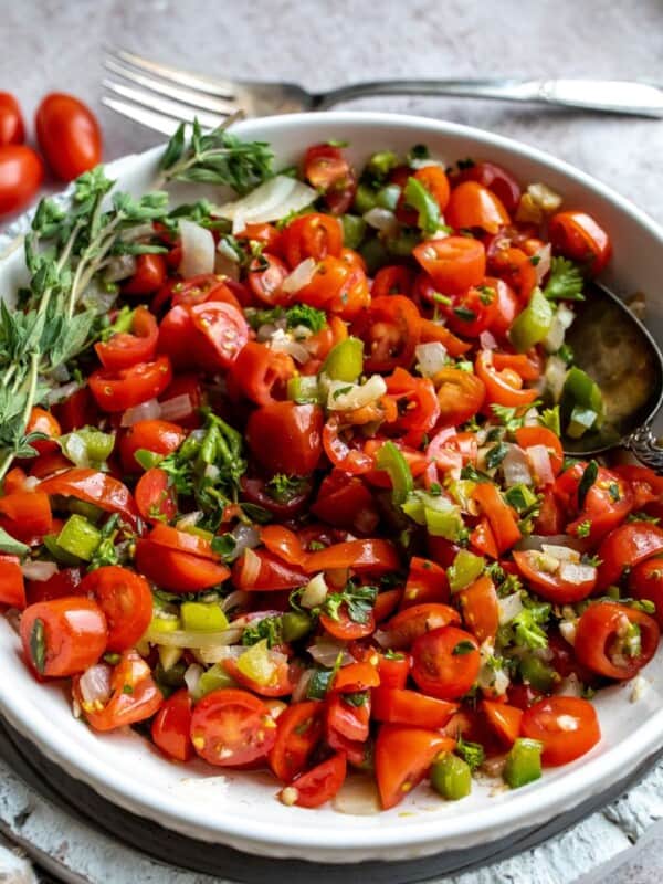 Tomato Relish in a large serving bowl with a silver serving spoon.