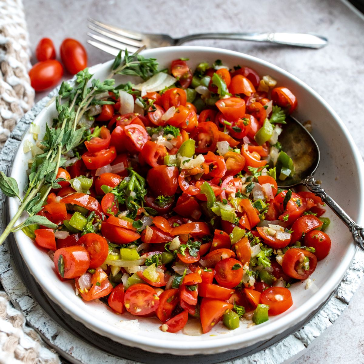 Tomato Relish in a large serving bowl with a silver serving spoon.