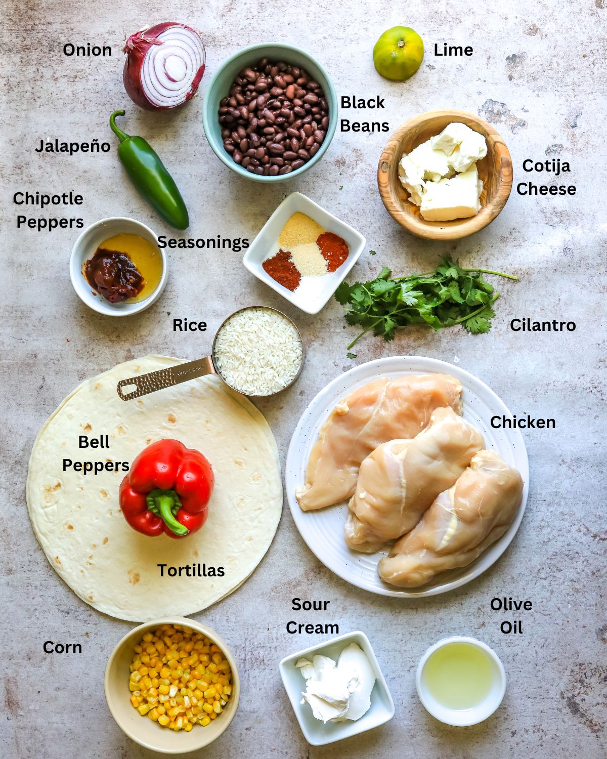 Chipotle chicken wrap ingredients needed for this recipe in small bowls and on plates. 