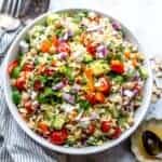 White bowl with close up of Lemon Orzo With feta and almonds.