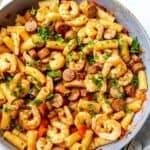 Cajun Shrimp And Sausage Pasta in a grey pan.