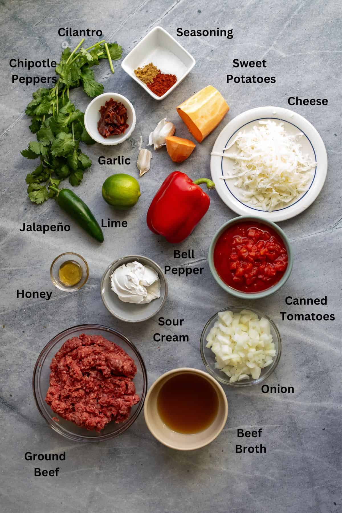 Ingredients on a counter in small bowls and on plates. 